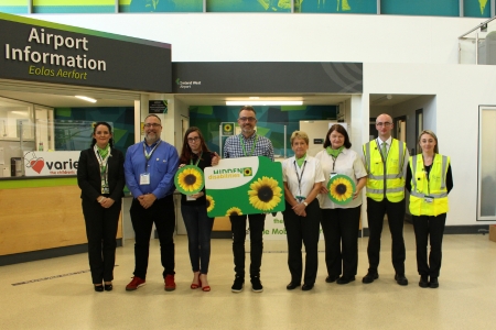 Image of airport staff at launch of the Sunflower initiative at the airport